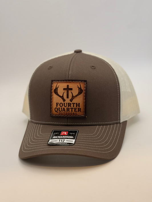 Brown and beige cap with a leather patch on a white background